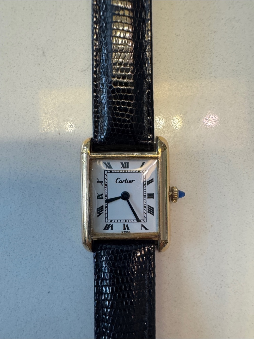 Cartier Gold Tone Rectangular Watch with dark brown Strap and sapphire Cabochon